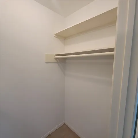 a view of a house with a yard and tree s