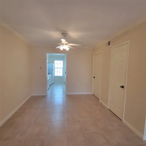a view of wooden floor and windows in an empty room