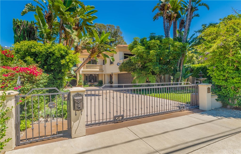 15237 Sutton Street Sherman Oaks, CA 91403 - Photo 1 of 31 a view of a deck with a large tree and a garden