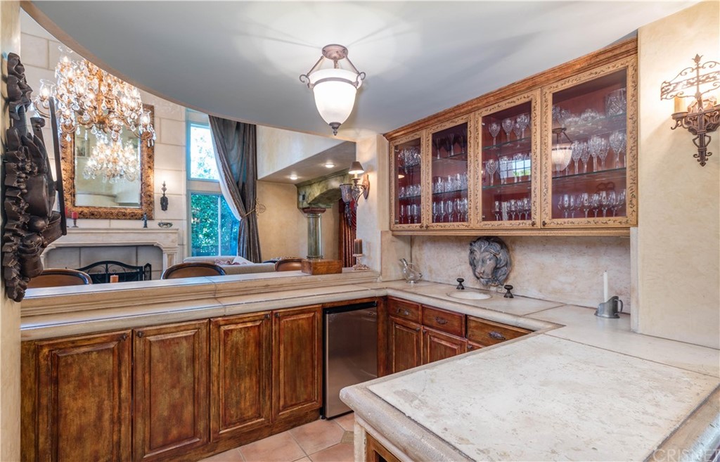 15237 Sutton Street Sherman Oaks, CA 91403 - Photo 11 of 31 a kitchen that has a sink and a view of living room