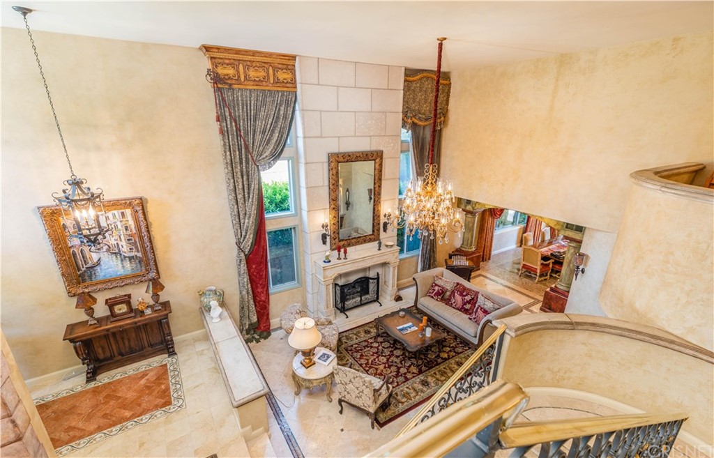 15237 Sutton Street Sherman Oaks, CA 91403 - Photo 14 of 31 a living room with furniture and a fireplace
