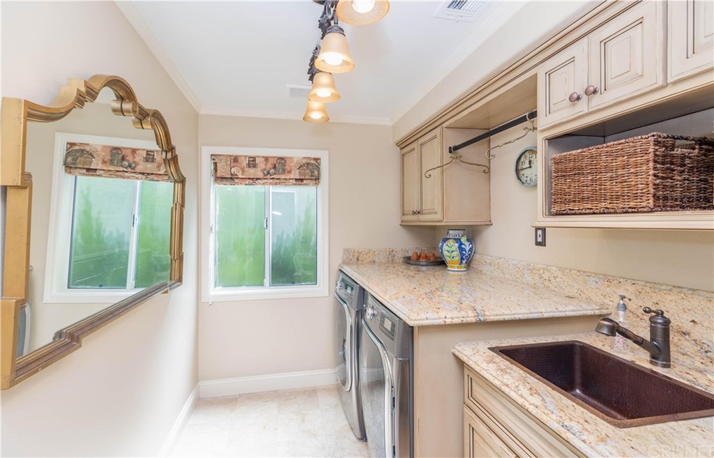 15237 Sutton Street Sherman Oaks, CA 91403 - Photo 21 of 31 a kitchen with a sink cabinets and window
