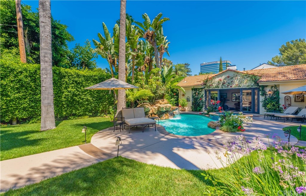 15237 Sutton Street Sherman Oaks, CA 91403 - Photo 25 of 31 a front view of a house with garden