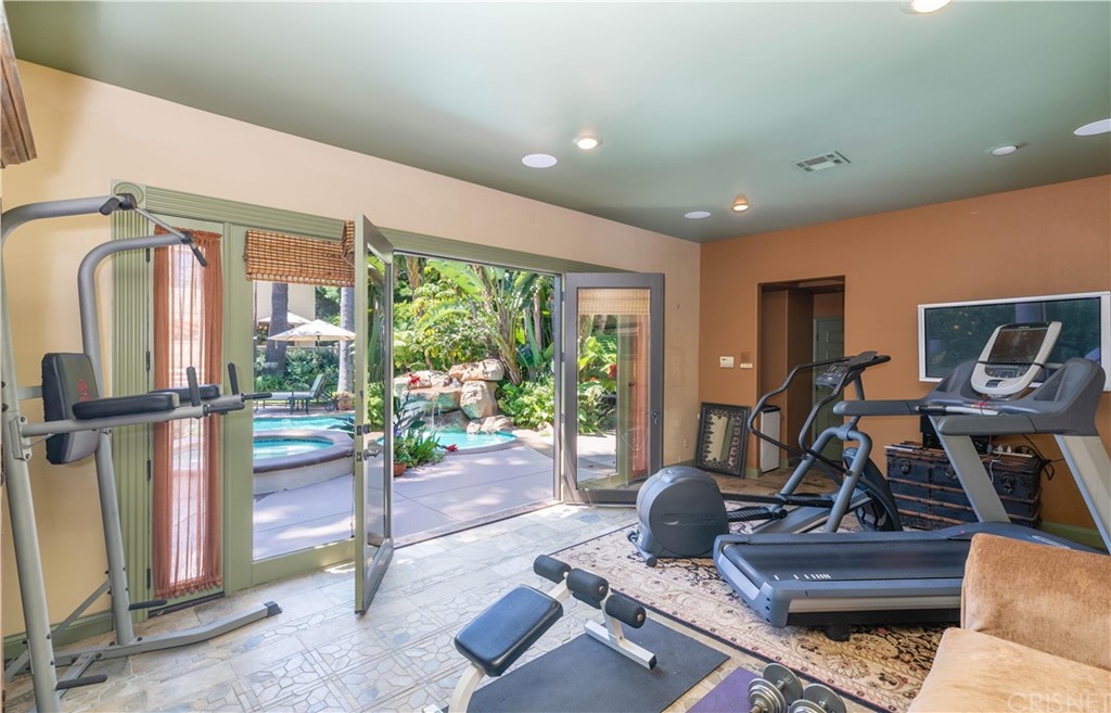 15237 Sutton Street Sherman Oaks, CA 91403 - Photo 28 of 31 a living room with furniture and a floor to ceiling window
