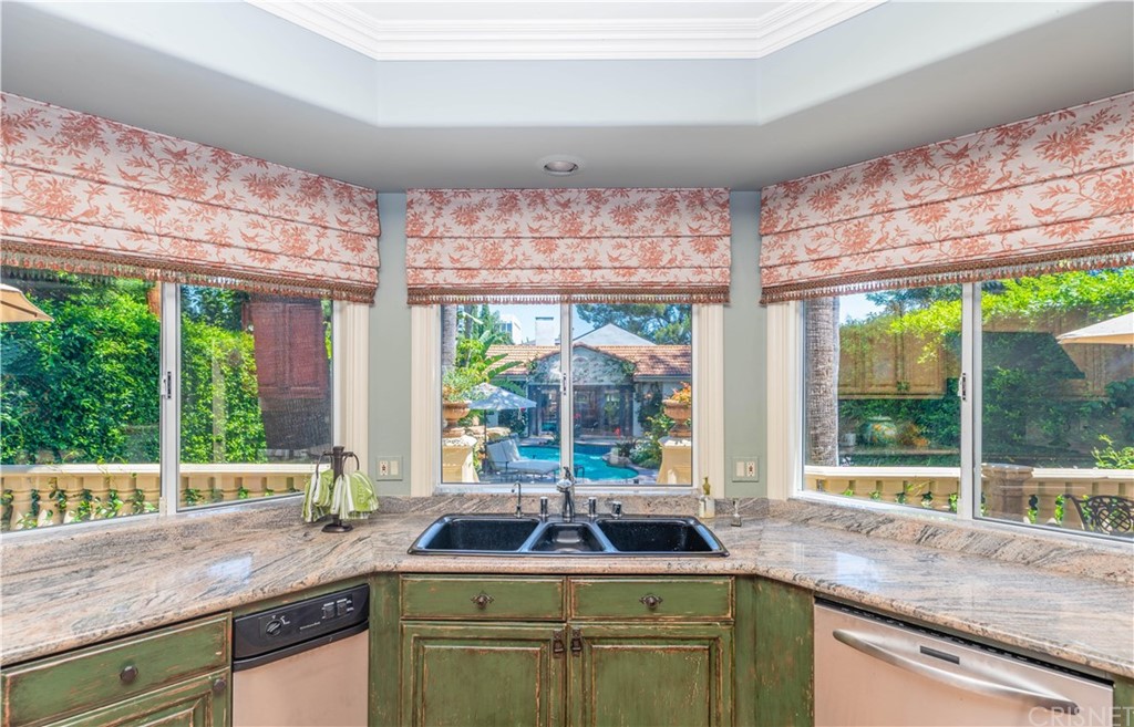 15237 Sutton Street Sherman Oaks, CA 91403 - Photo 8 of 31 a kitchen with a sink and a large window