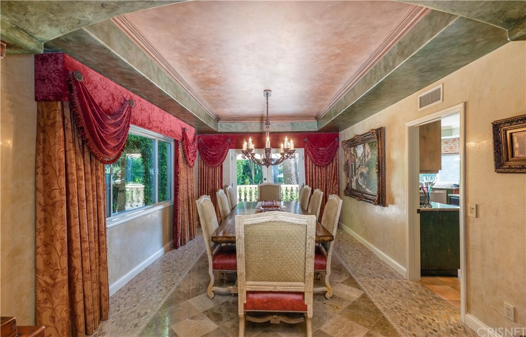 15237 Sutton Street Sherman Oaks, CA 91403 - Photo 10 of 31 a dining room with furniture a chandelier and window