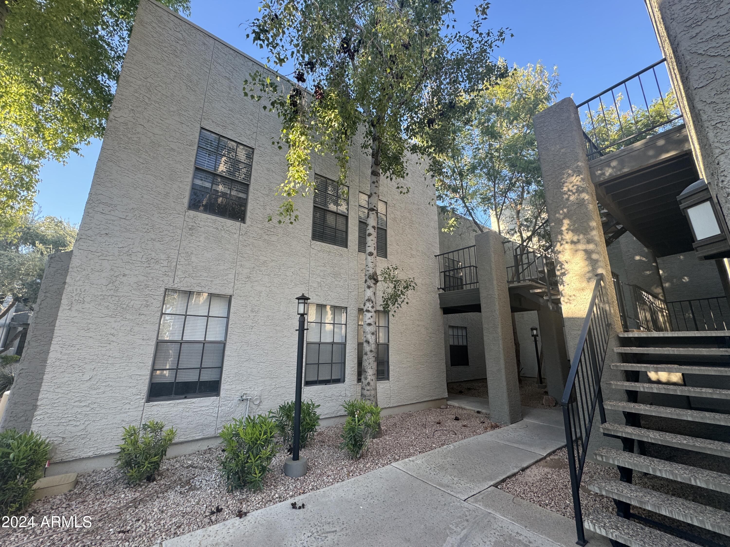 8020 East Thomas Road, Unit 226 Scottsdale, AZ 85251 - Photo 4 of 16 a front view of a house
