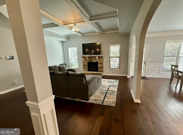 a kitchen with a refrigerator and a stove top oven