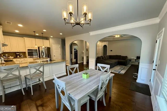 a kitchen with stainless steel appliances granite countertop a refrigerator sink and cabinets