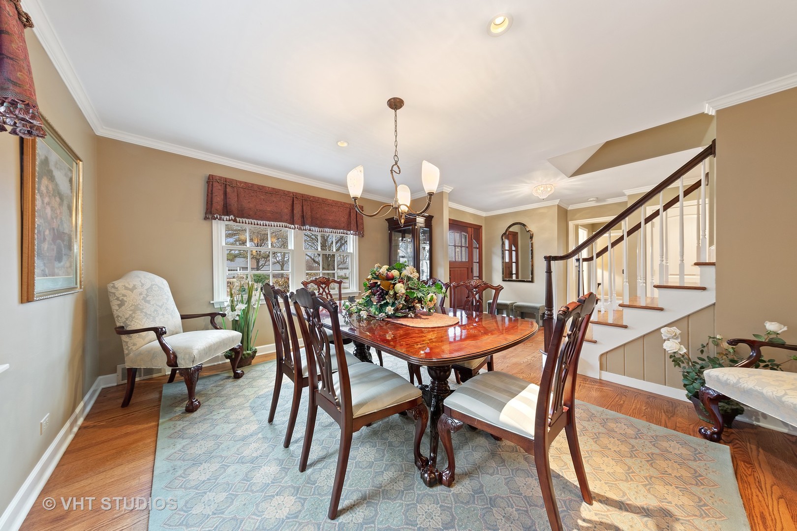 1140 Woodview Road Burr Ridge, IL 60527 - Photo 8 of 35 a view of a dining room with furniture and wooden floor