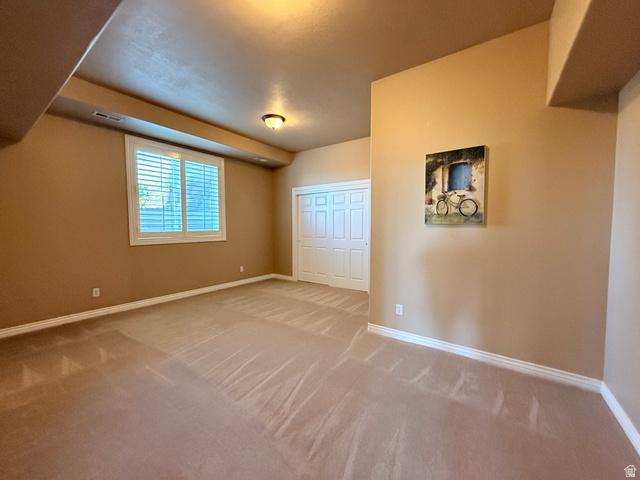1562 Fairway Ridge Road Draper, UT 84020 - Photo 45 of 60 Room featuring neutral-toned walls, white baseboards, and wall-to-wall carpeting