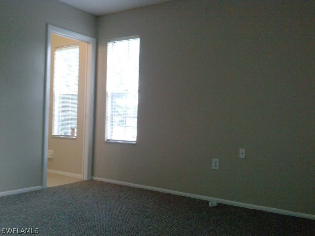 9099 Henry Road Fort Myers, FL 33967 - Photo 5 of 10 an empty room with a window