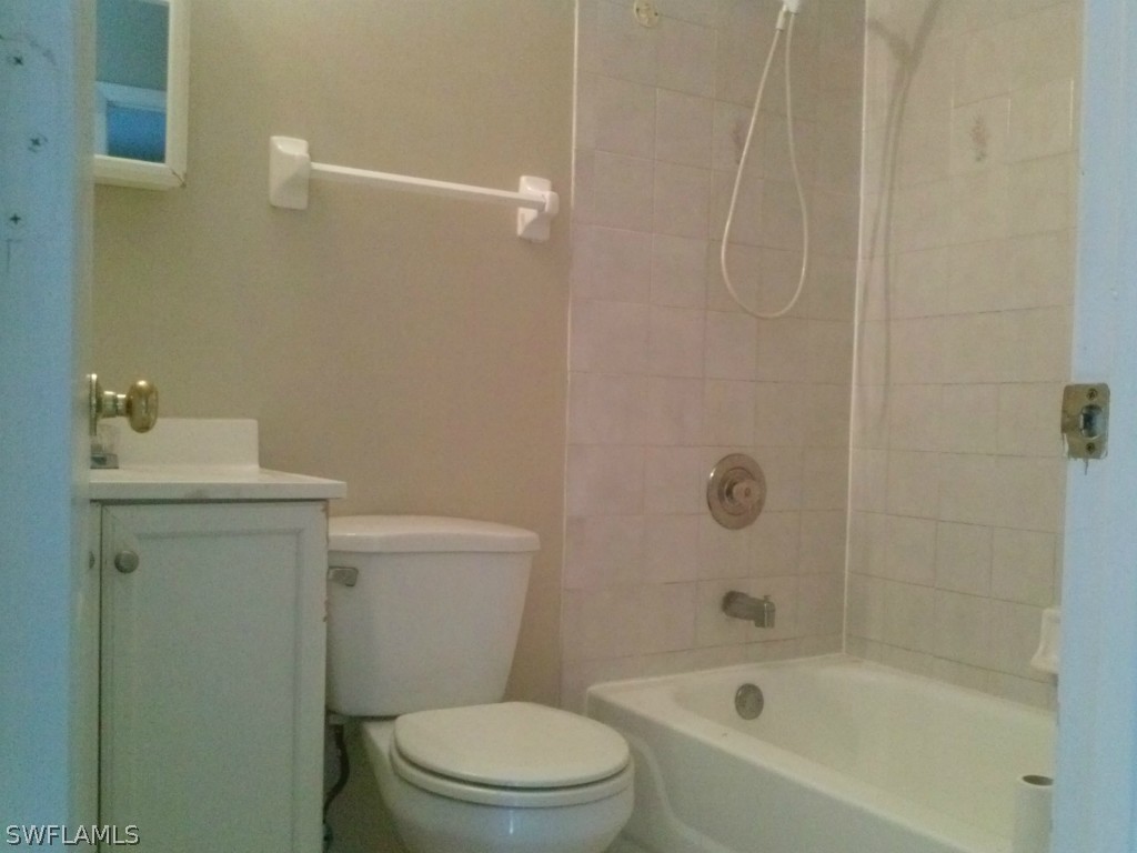9099 Henry Road Fort Myers, FL 33967 - Photo 6 of 10 a bathroom with a toilet and shower