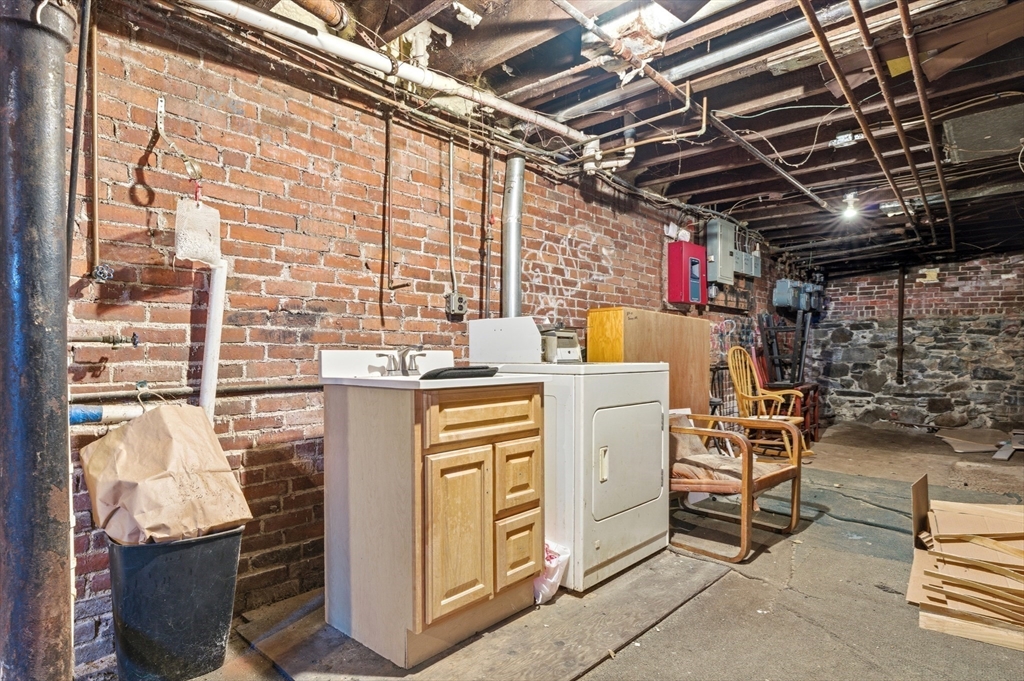 204 Washington Street, Unit 1 Somerville, MA 02143 - Photo 14 of 19 a utility room with dryer and washer