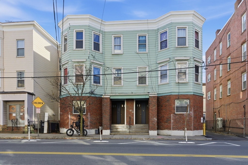 204 Washington Street, Unit 1 Somerville, MA 02143 - Photo 17 of 19 a view of a building with a street