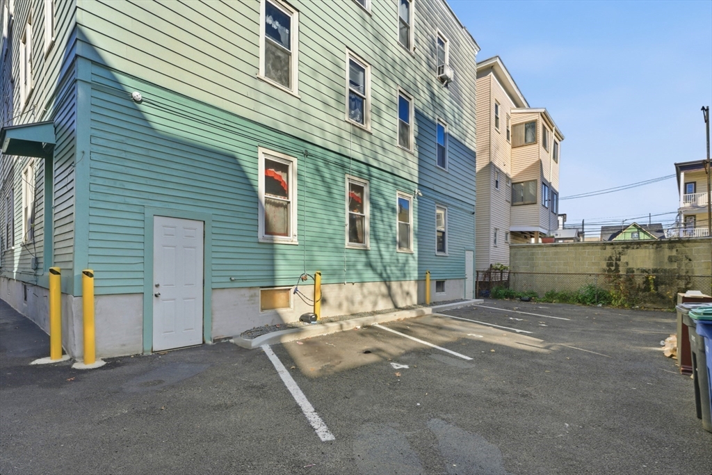 204 Washington Street, Unit 1 Somerville, MA 02143 - Photo 19 of 19 a view of a house with a patio
