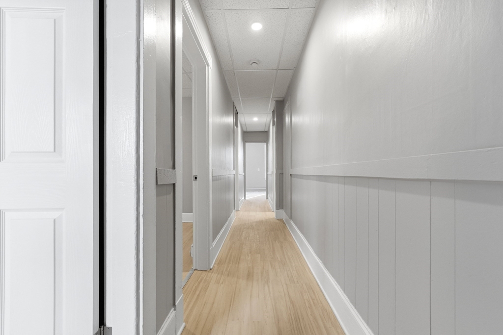 204 Washington Street, Unit 1 Somerville, MA 02143 - Photo 9 of 19 a view of a hallway with wooden floor