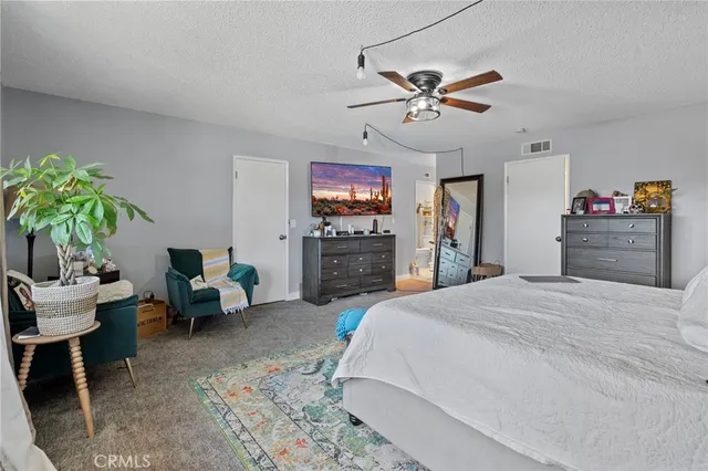 a bathroom with a double vanity sink mirror and toilet