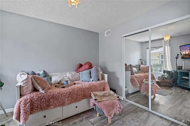 a bedroom with two beds and a couch