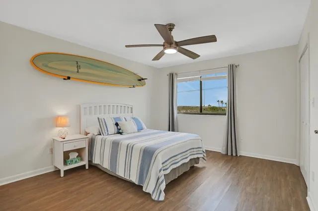 a bedroom with a bed and a chair