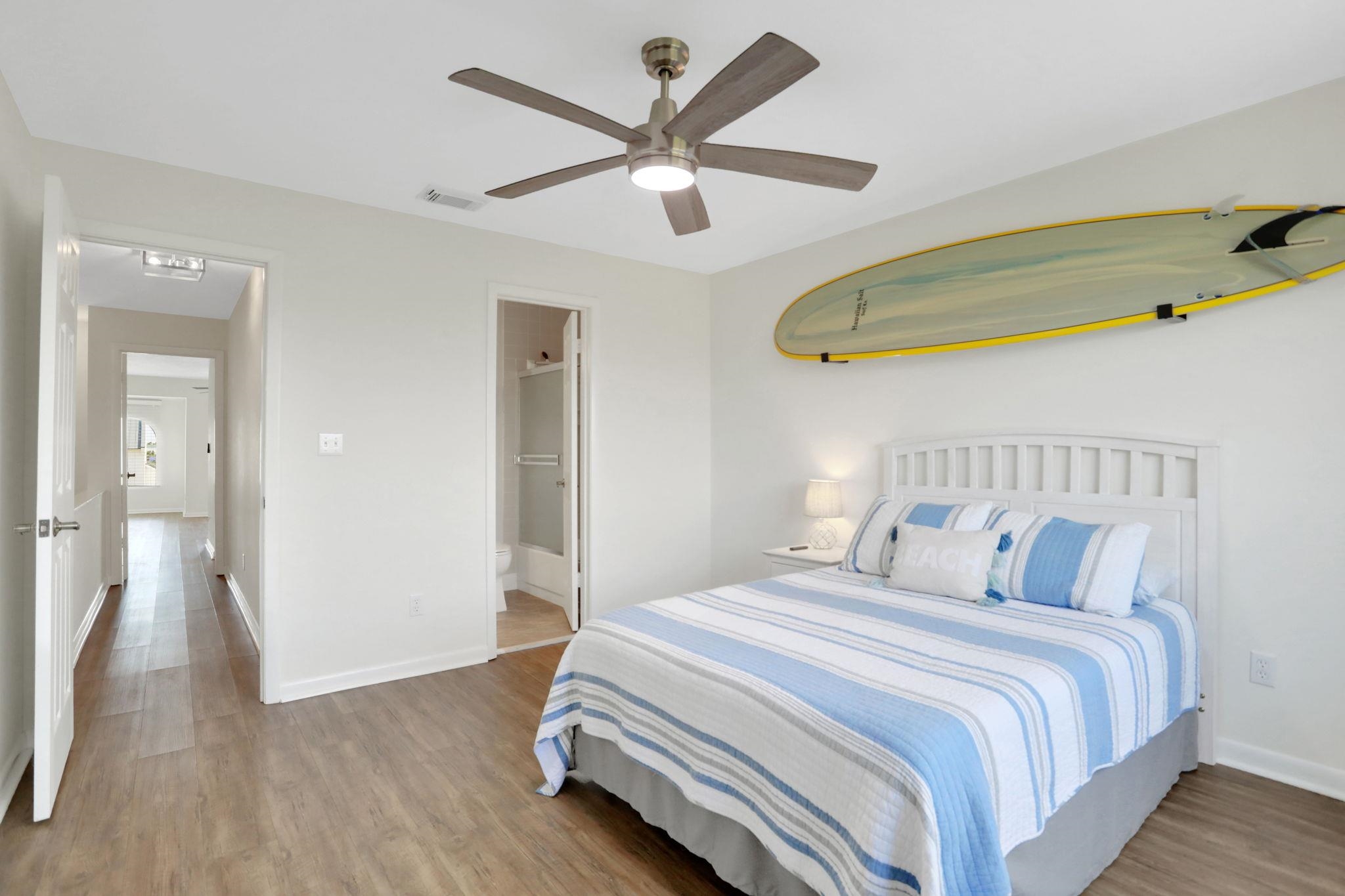 120 Sunset Harbor Way, Unit 202 St. Augustine, FL 32080 - Photo 21 of 50 a bedroom with bed and a chandelier