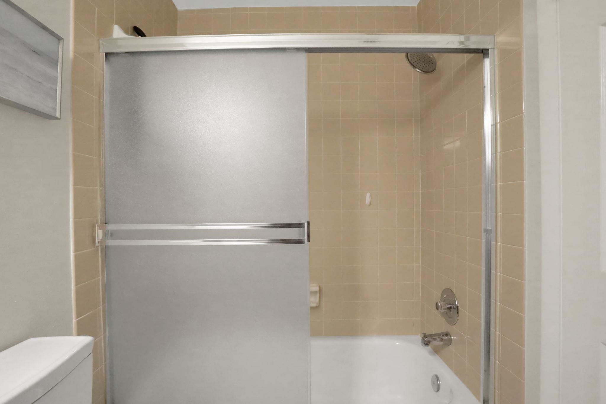 120 Sunset Harbor Way, Unit 202 St. Augustine, FL 32080 - Photo 23 of 50 a bathroom with a shower