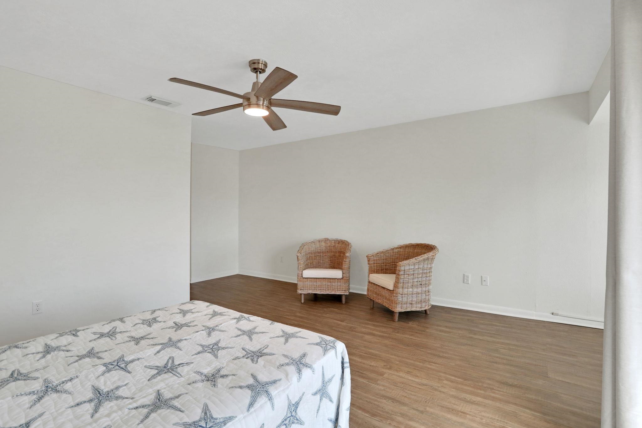 120 Sunset Harbor Way, Unit 202 St. Augustine, FL 32080 - Photo 26 of 50 a bedroom with a bed and a chair