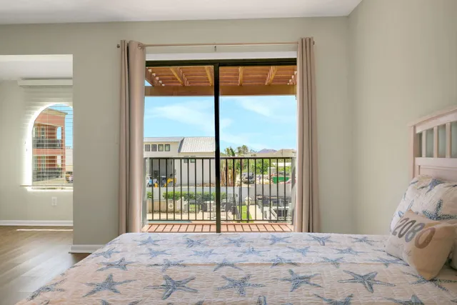 a view of a swimming pool with outdoor seating