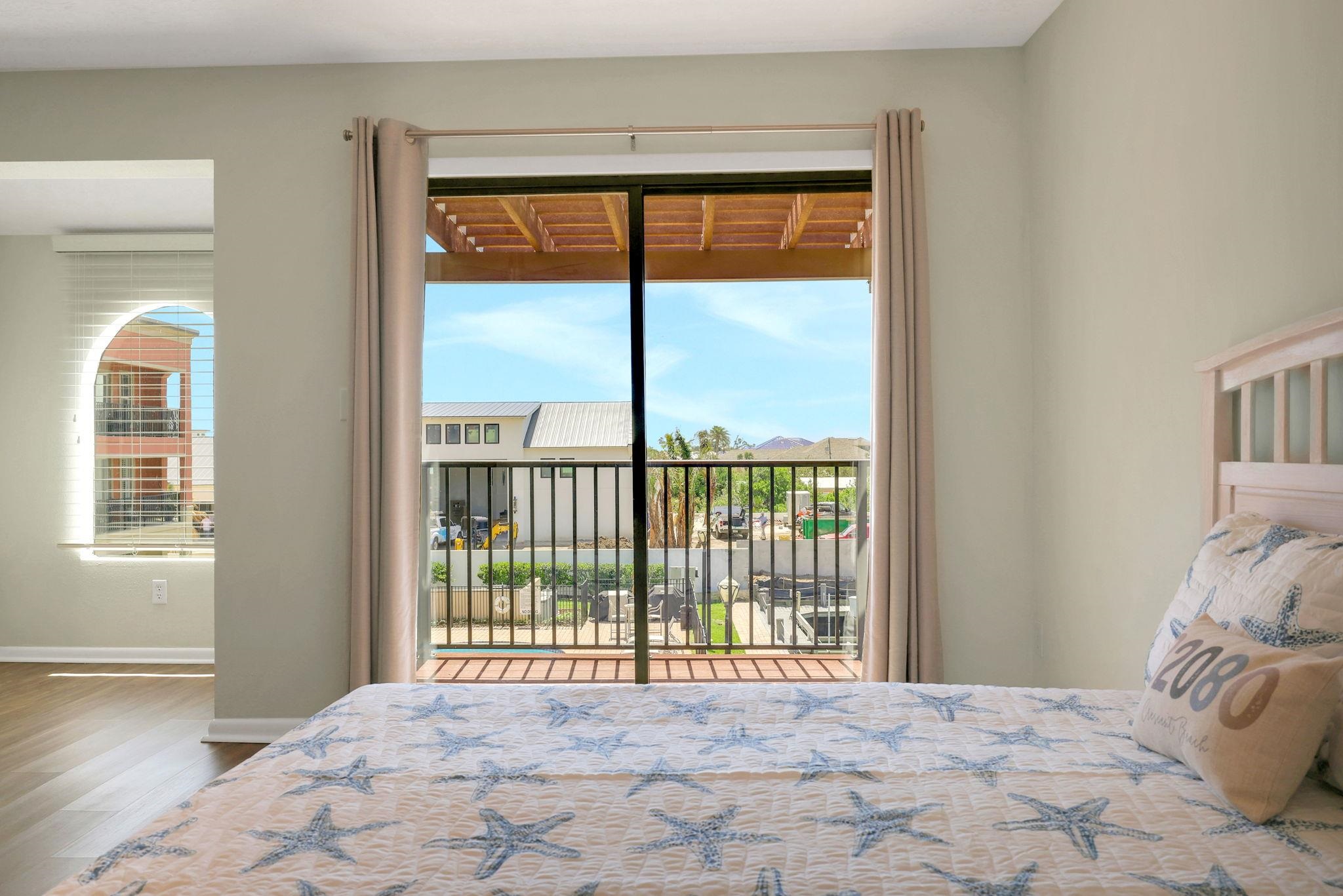 120 Sunset Harbor Way, Unit 202 St. Augustine, FL 32080 - Photo 28 of 50 a view of a bedroom with a bed and wooden floor