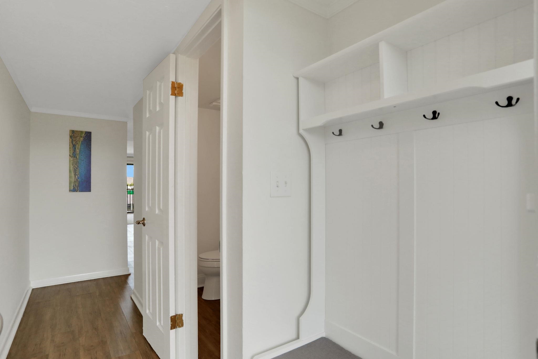 120 Sunset Harbor Way, Unit 202 St. Augustine, FL 32080 - Photo 5 of 50 a view of a hallway with wooden floor and closet