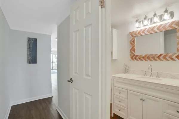 a bathroom with a sink a mirror and a toilet