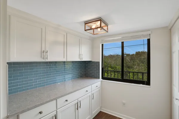 a kitchen with a sink stove and refrigerator