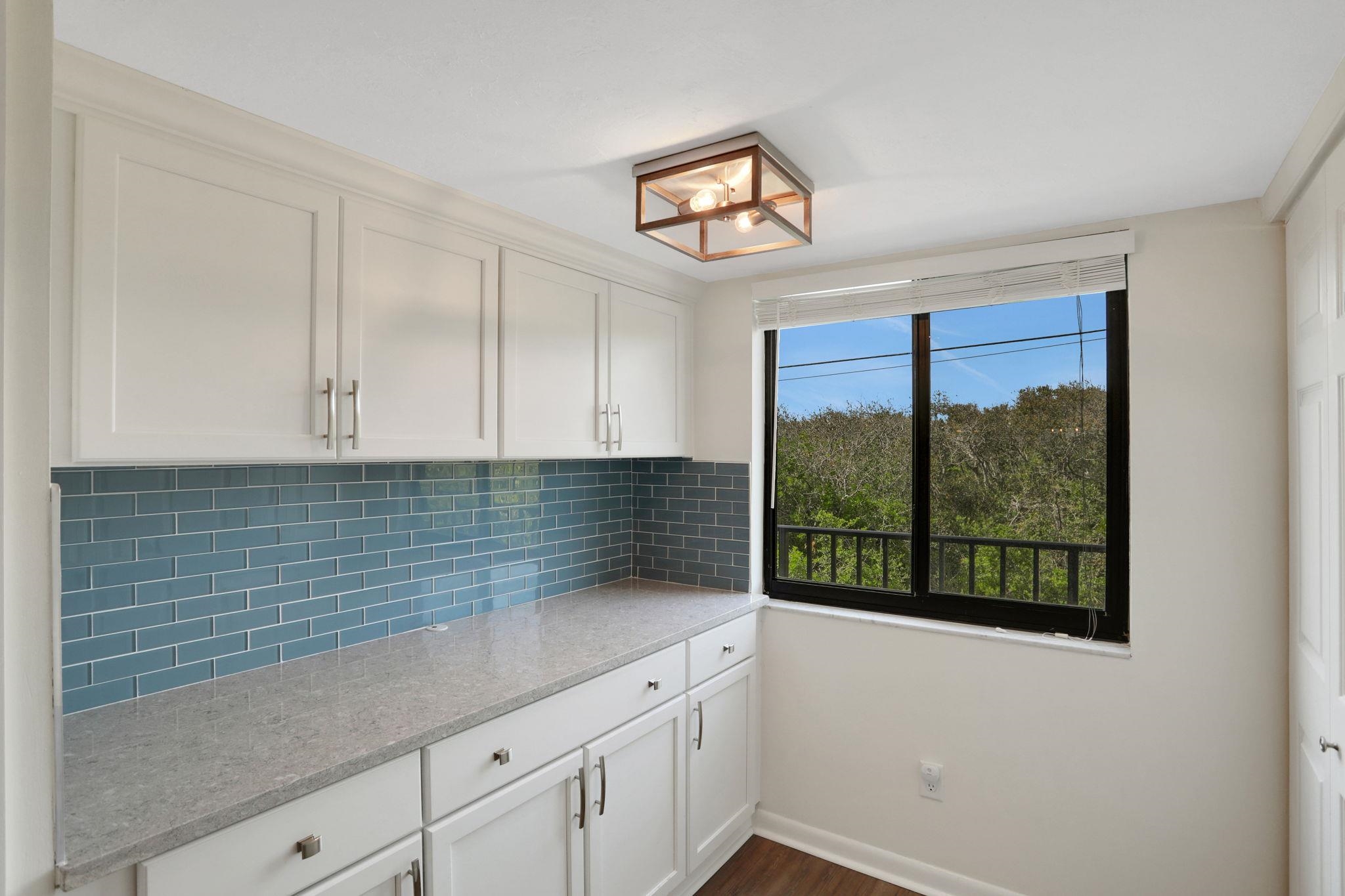 120 Sunset Harbor Way, Unit 202 St. Augustine, FL 32080 - Photo 8 of 50 a kitchen with a sink and cabinets