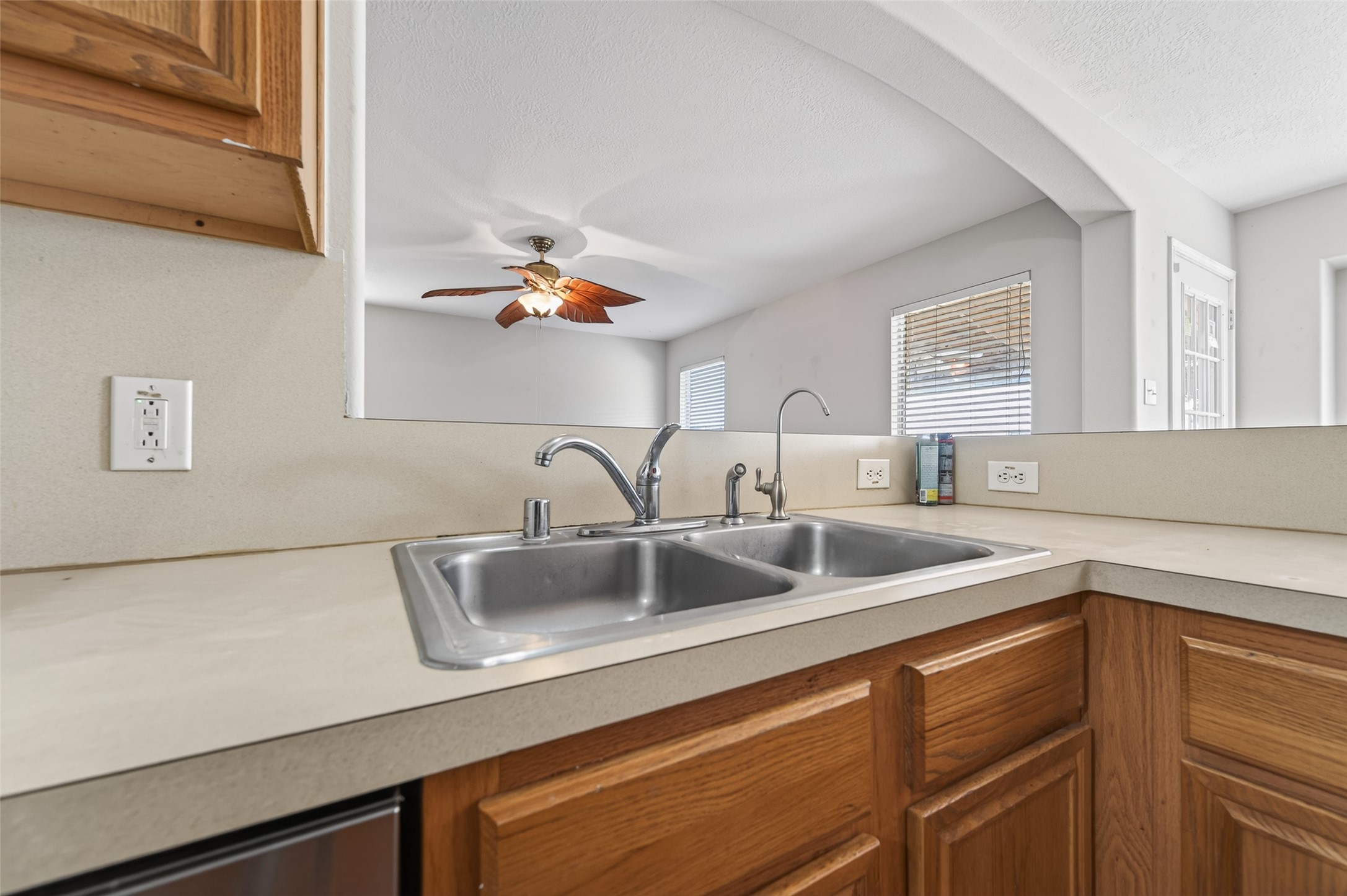 20347 Hunterclif Lane Katy, TX 77449 - Photo 18 of 39 Functional kitchen layout with double-basin sink and view into the living area.