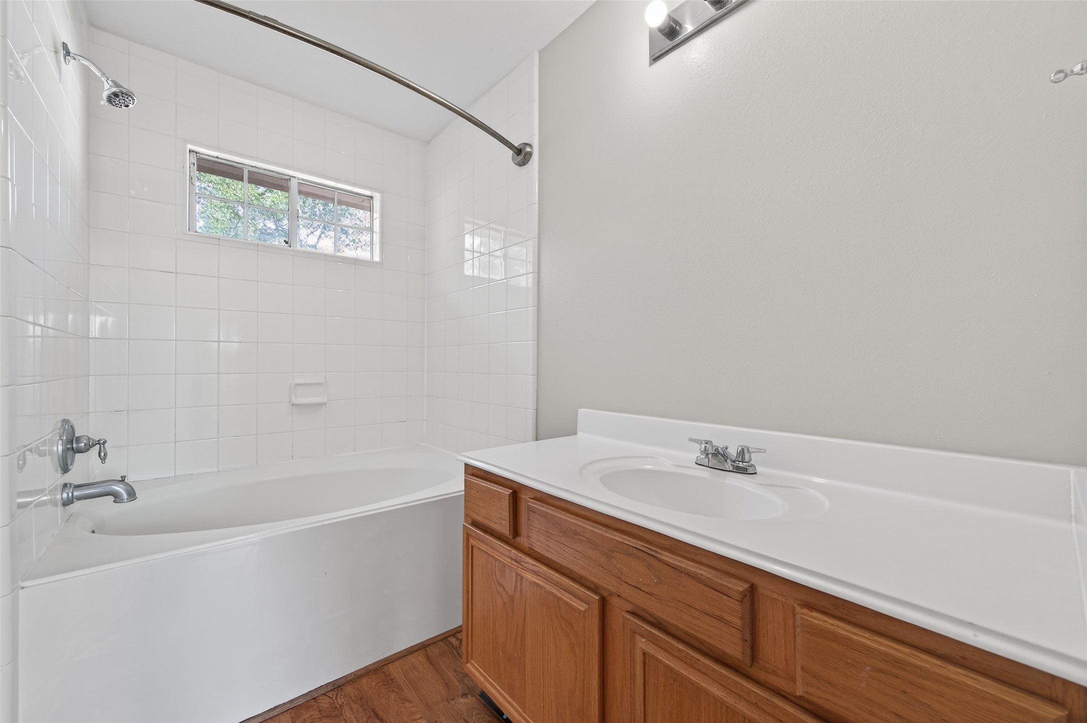 20347 Hunterclif Lane Katy, TX 77449 - Photo 25 of 39 The ensuite full bath features a wide vanity, a tub-shower combination, and a clean, bright layout.