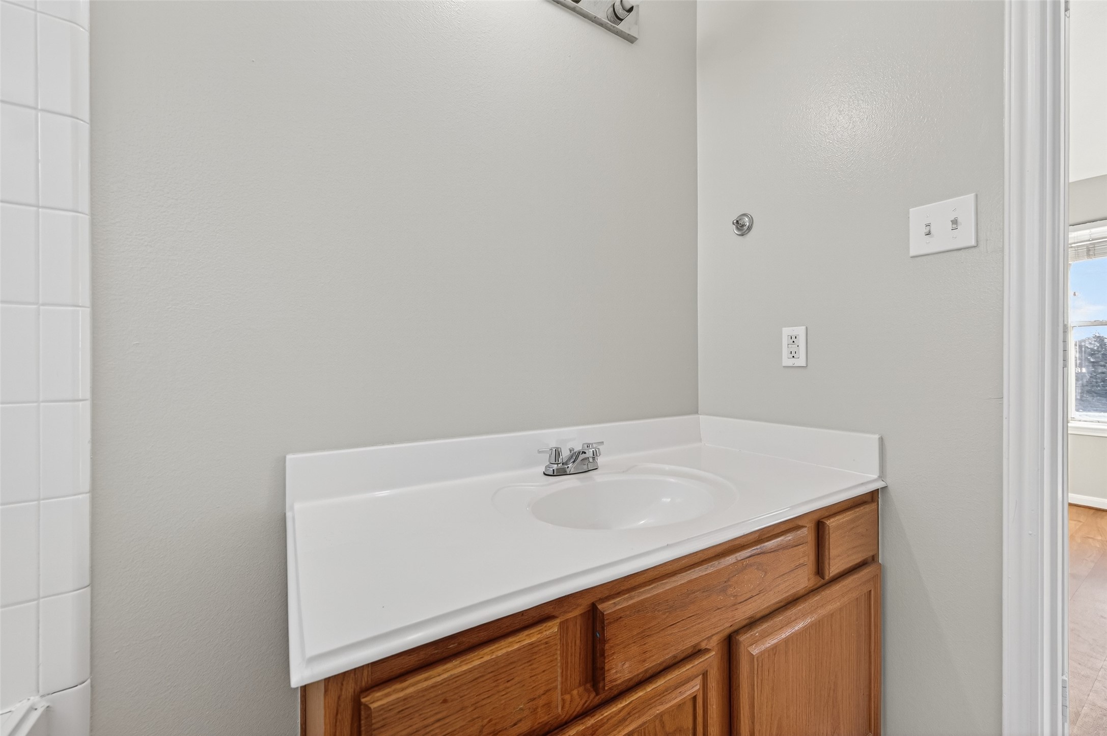 20347 Hunterclif Lane Katy, TX 77449 - Photo 27 of 39 Detailed look at the bathroom vanity showing the single basin sink, ample counter space, and warm wood cabinetry.
