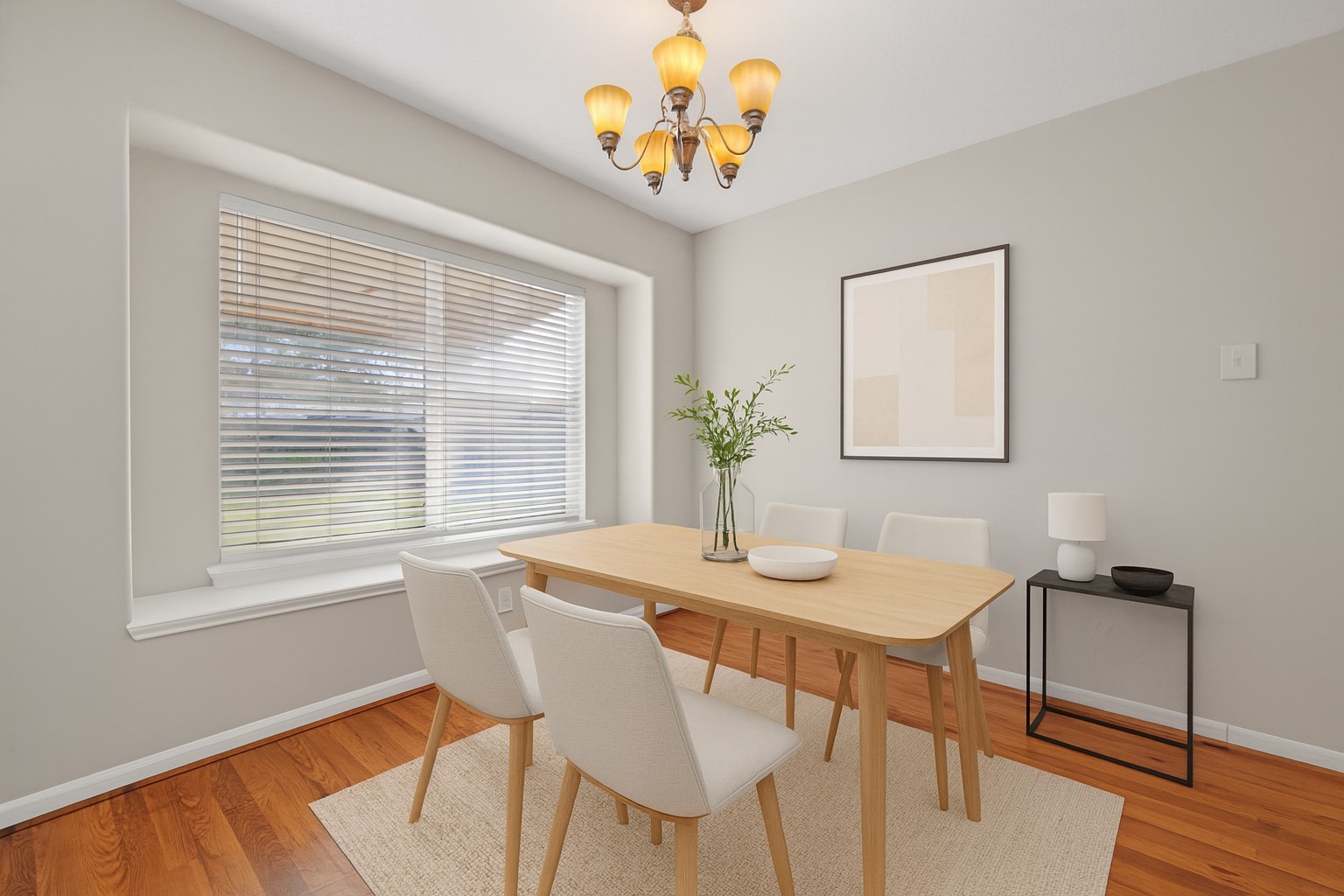 20347 Hunterclif Lane Katy, TX 77449 - Photo 3 of 39 This virtually staged dining area features wood flooring, a statement light fixture, and a large window that brings in natural light.