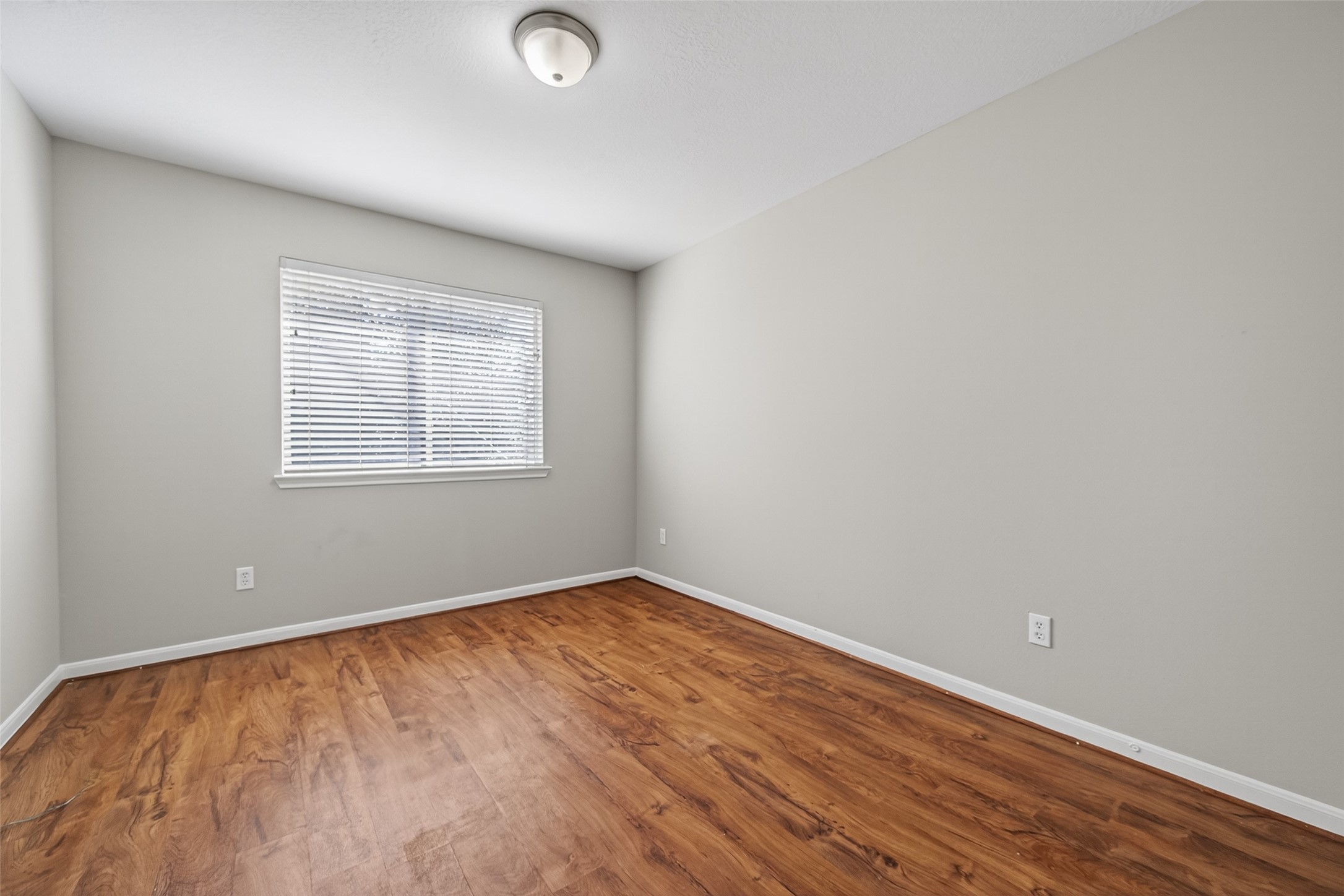 20347 Hunterclif Lane Katy, TX 77449 - Photo 32 of 39 This third bedroom offers wood floors, a bright window, and flexible space for various uses.