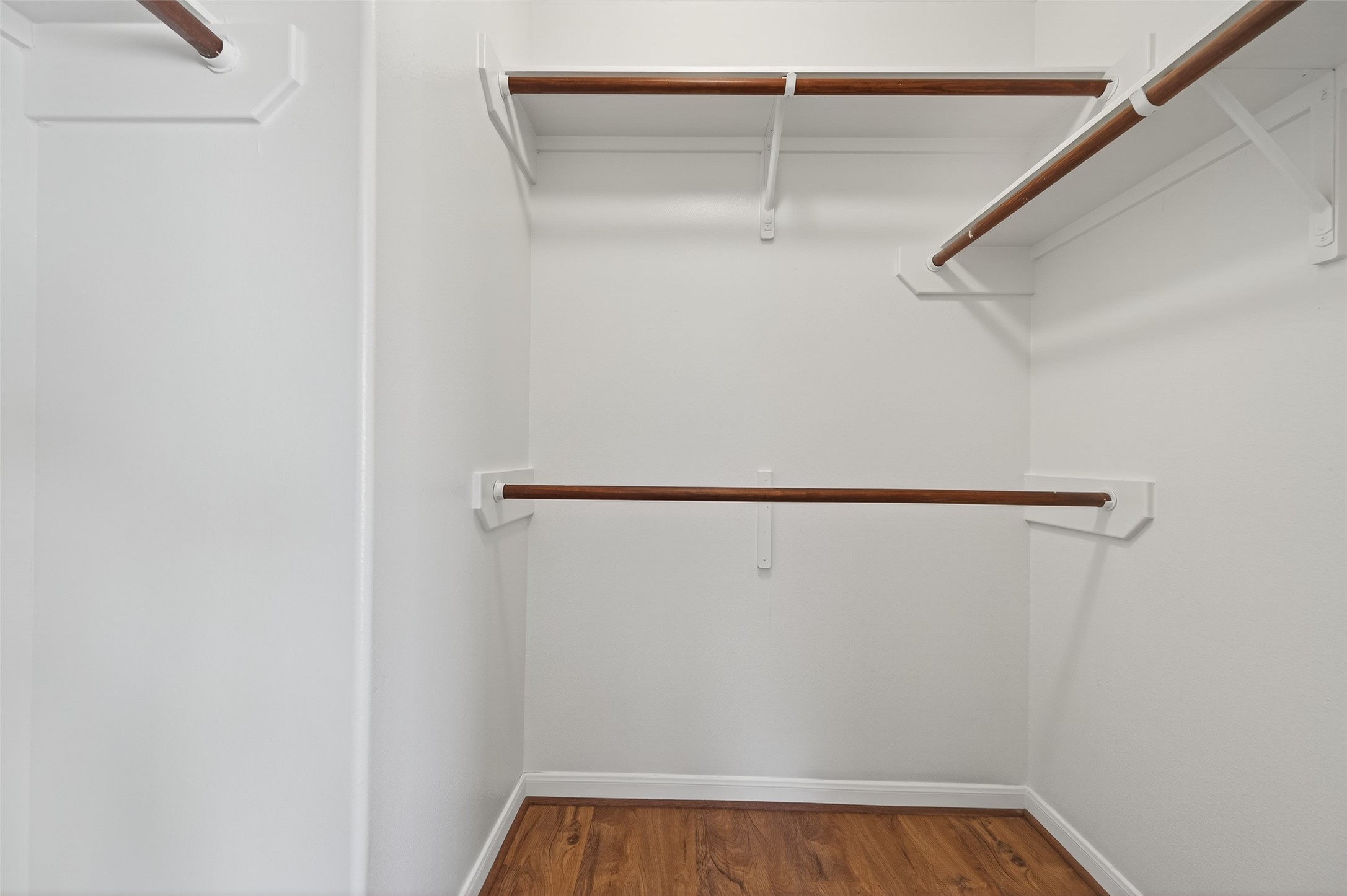 20347 Hunterclif Lane Katy, TX 77449 - Photo 34 of 39 The walk-in closet features built-in shelving and hanging rods for organized storage.