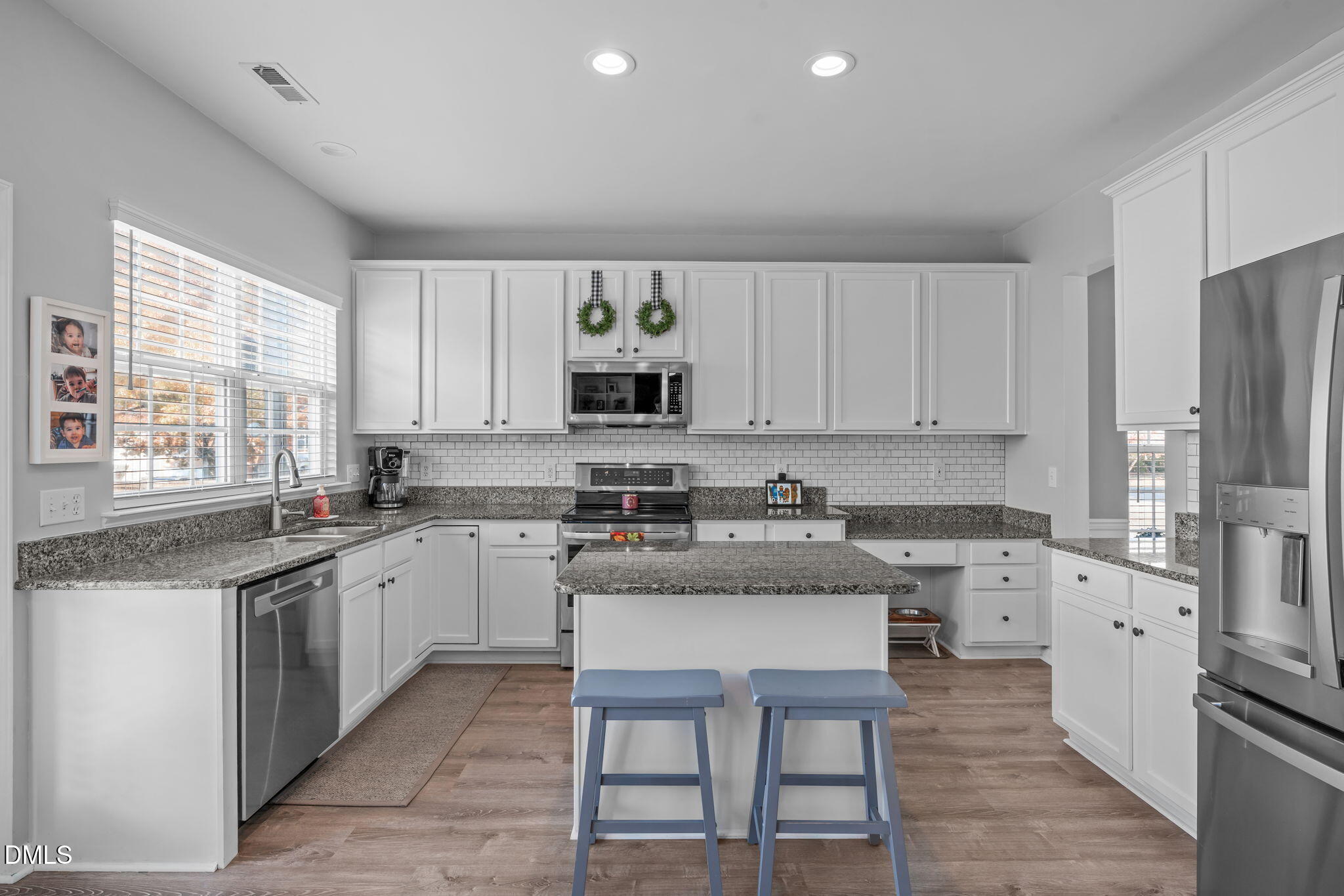 7461 Lagrange Drive Raleigh, NC 27613 - Photo 19 of 54 a kitchen with cabinets appliances a sink and a window
