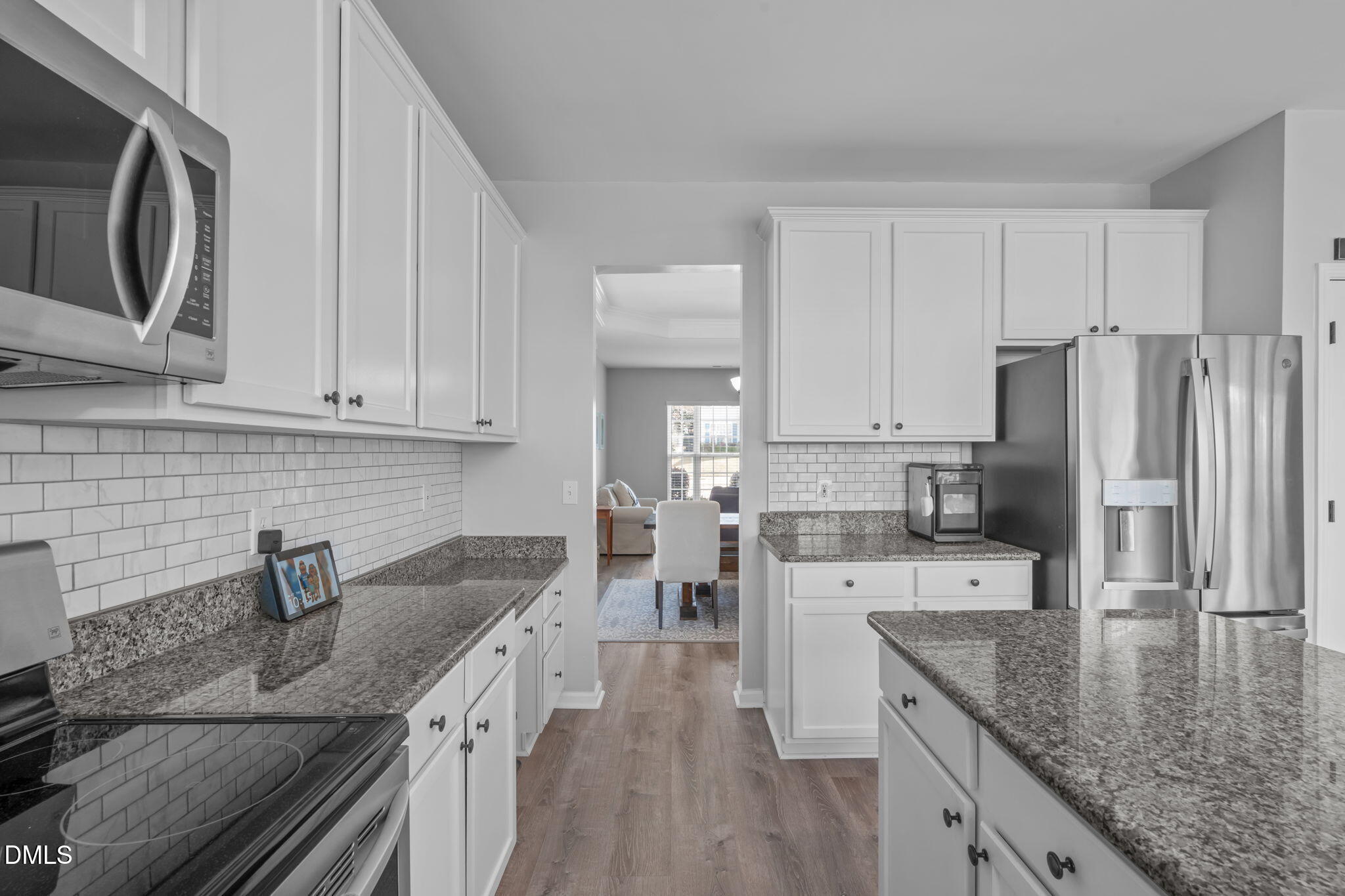 7461 Lagrange Drive Raleigh, NC 27613 - Photo 22 of 54 a kitchen with stainless steel appliances granite countertop a sink stove and refrigerator