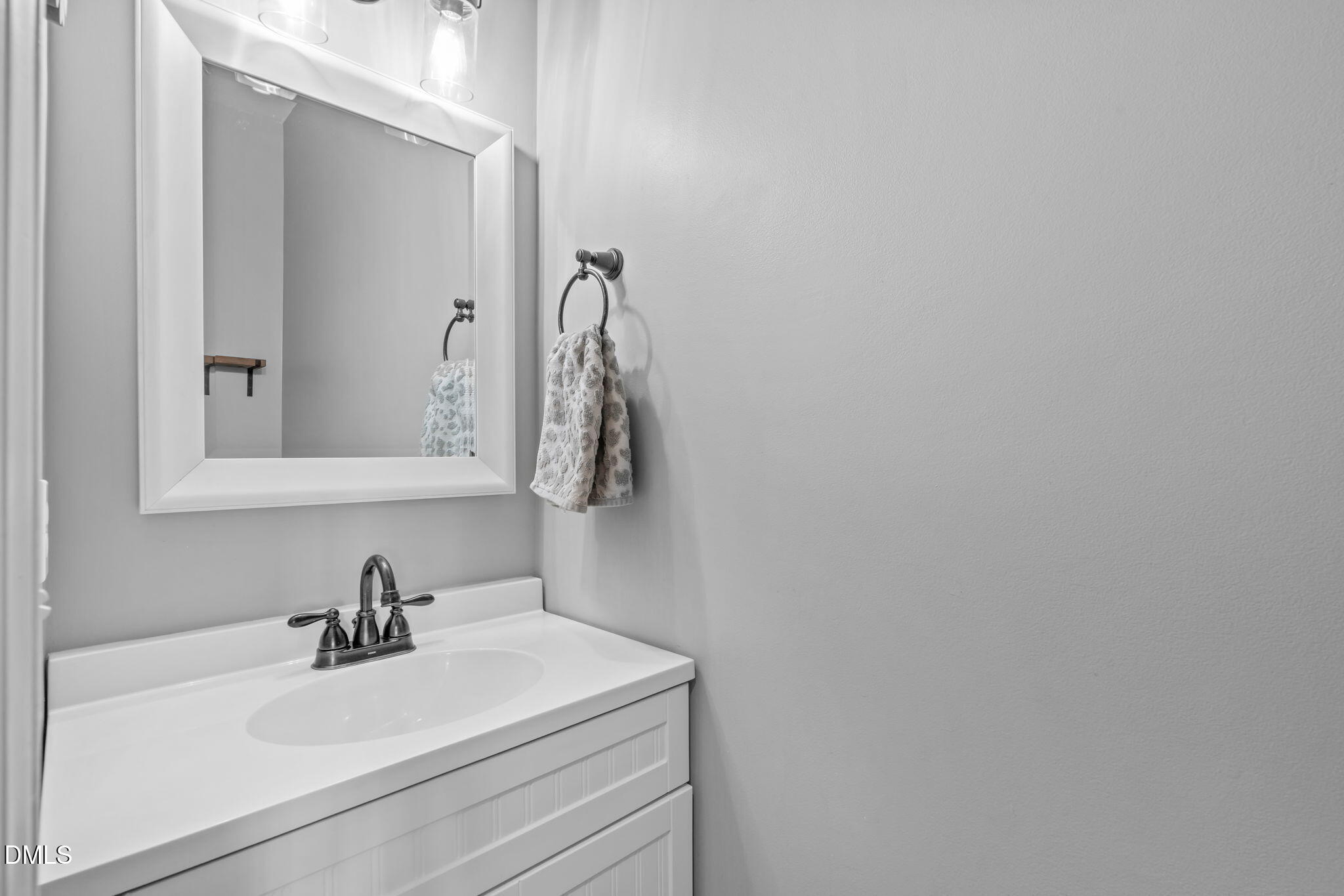 7461 Lagrange Drive Raleigh, NC 27613 - Photo 25 of 54 a bathroom with a sink and a mirror