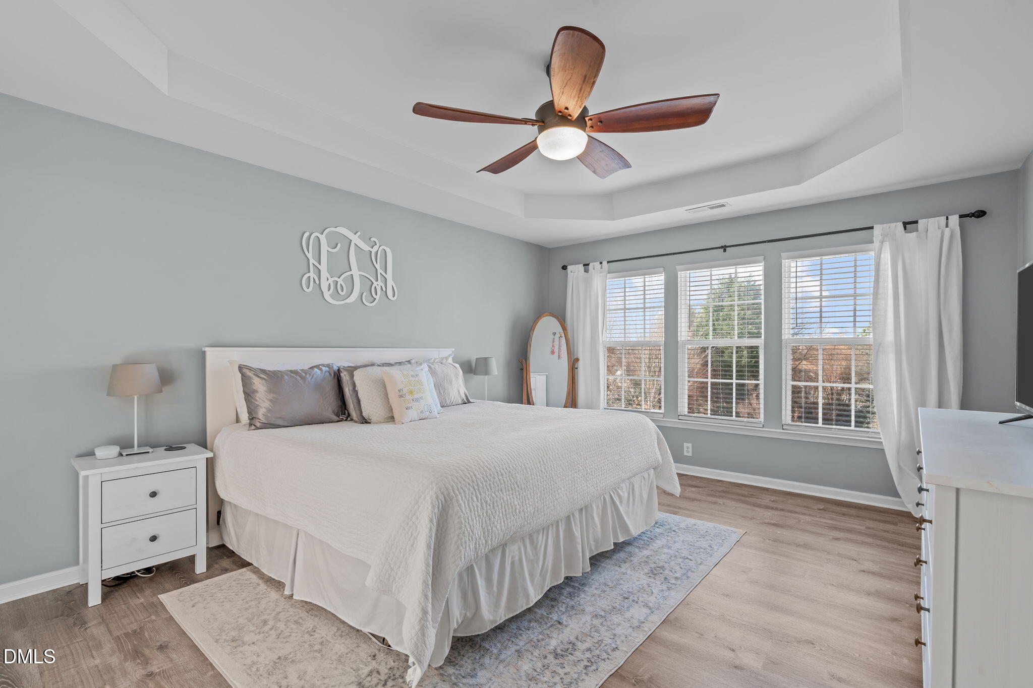 7461 Lagrange Drive Raleigh, NC 27613 - Photo 28 of 54 a bedroom with a large bed and a large window