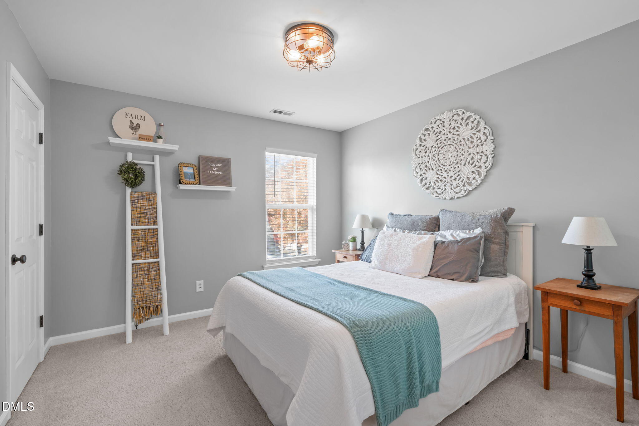 7461 Lagrange Drive Raleigh, NC 27613 - Photo 37 of 54 a bedroom with a bed and a window