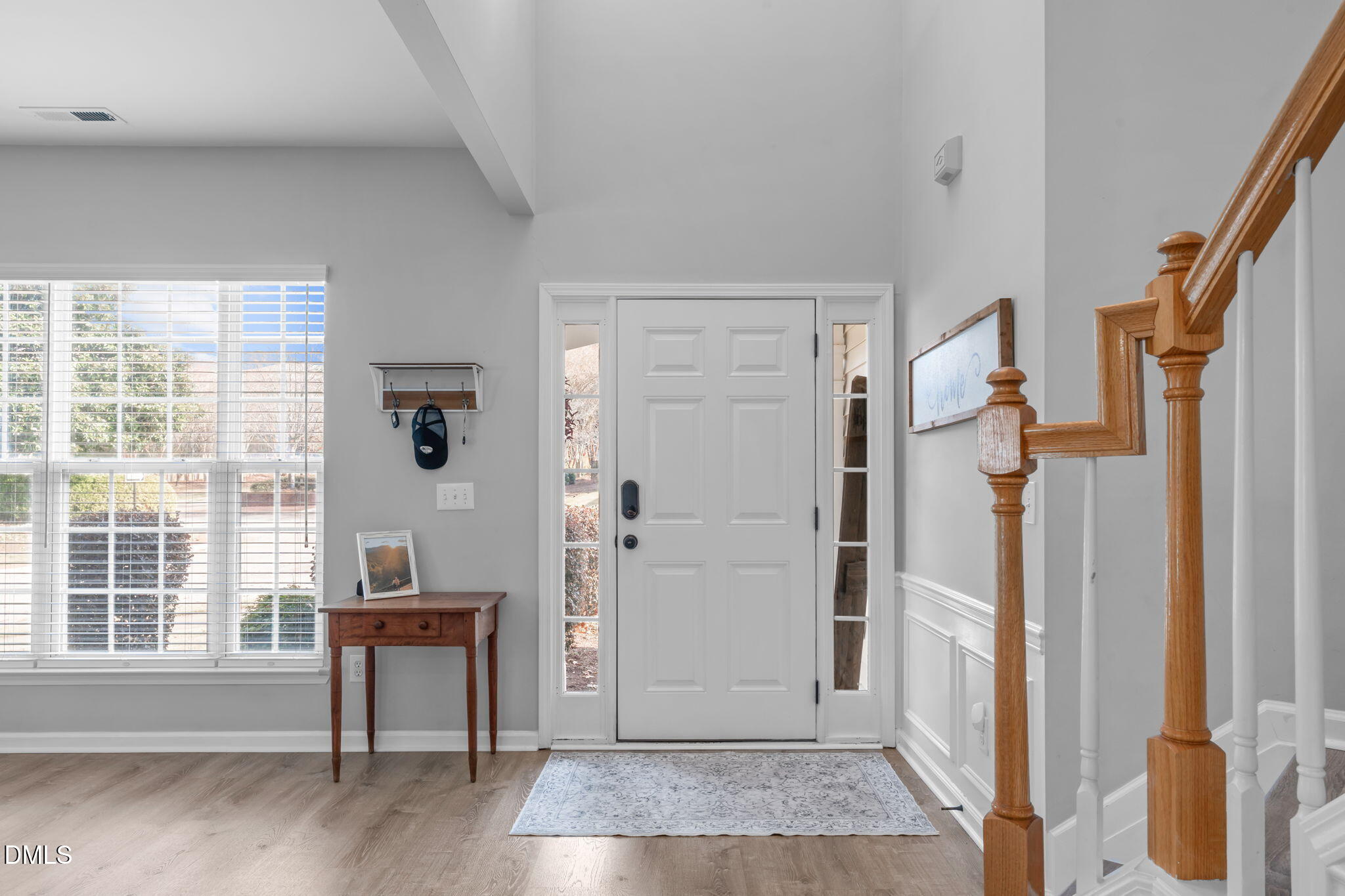 7461 Lagrange Drive Raleigh, NC 27613 - Photo 3 of 54 a view of a livingroom with wooden floor and a window