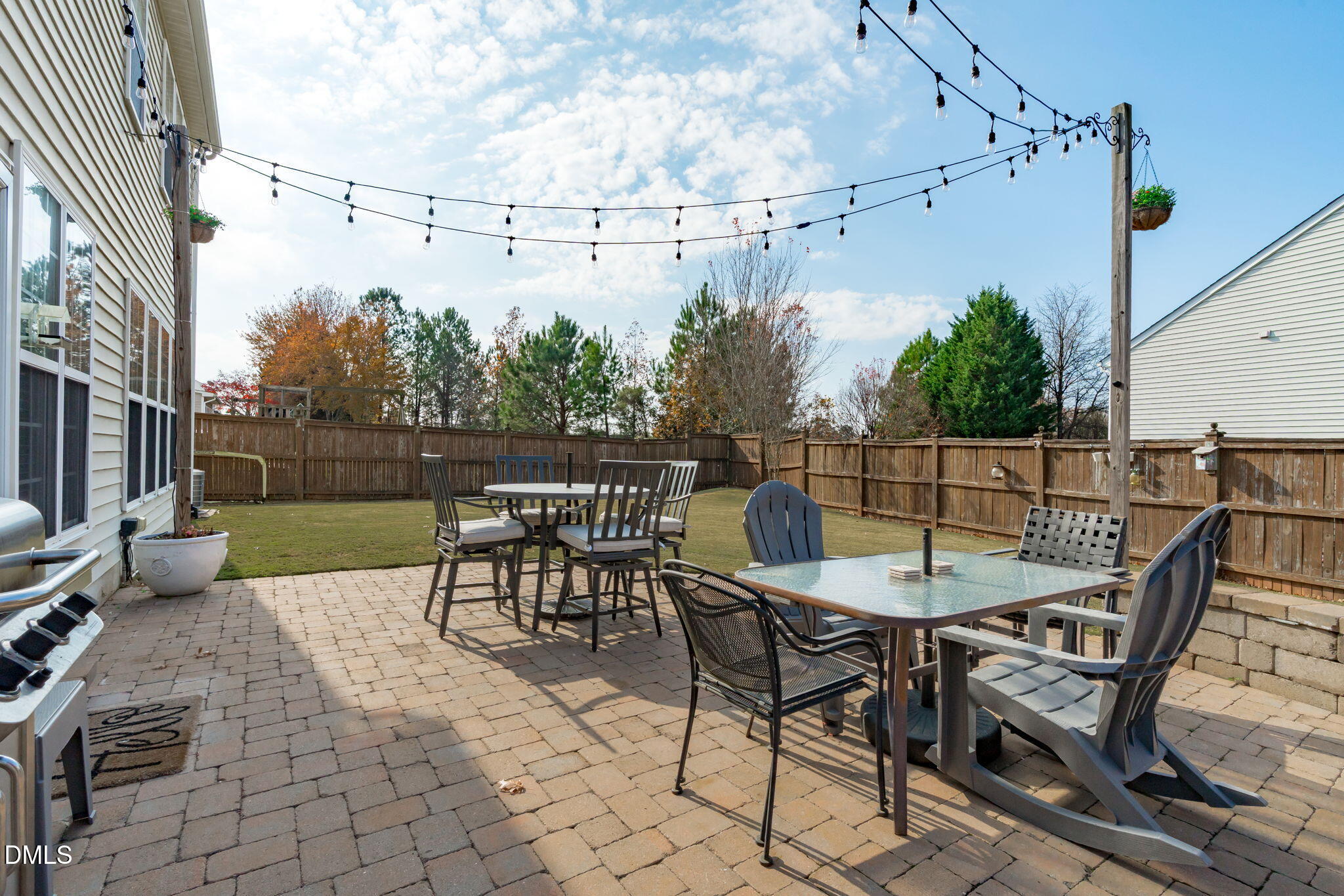 7461 Lagrange Drive Raleigh, NC 27613 - Photo 44 of 54 a view of a chairs and table in the back yard