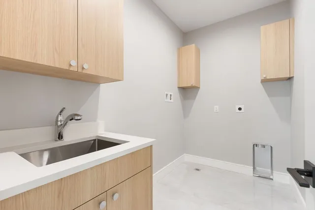a bathroom with a sink and cabinets