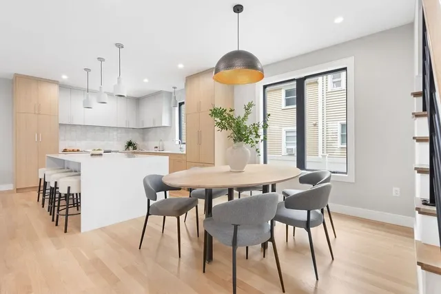 a view of a dining room with furniture window and wooden floor