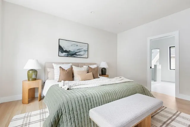 a bedroom with a bed and a couch