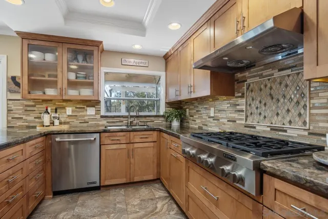 a kitchen with a stove and a shower